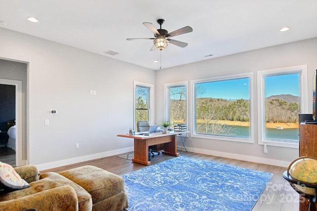 home office featuring baseboards, visible vents, a ceiling fan, wood finished floors, and recessed lighting