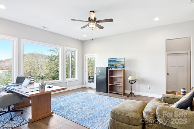 office featuring visible vents, baseboards, a ceiling fan, wood finished floors, and recessed lighting