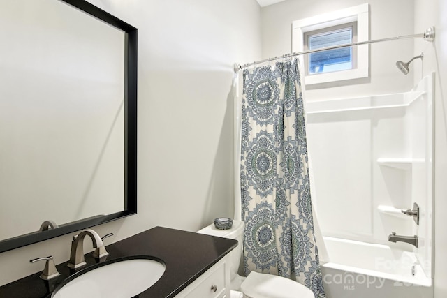 bathroom featuring toilet, shower / bath combo with shower curtain, and vanity