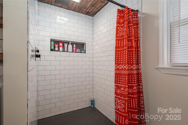 full bath with a tile shower