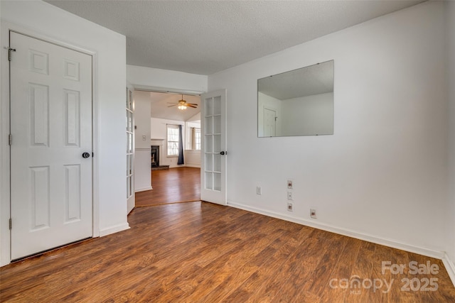 11000 White Stag Dr, Charlotte, NC 28269 - unfurnished room featuring wood finished floors, a textured ceiling, and french doors