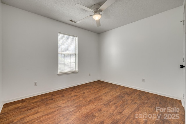 11000 White Stag Dr, Charlotte, NC 28269 - empty room featuring wood finished floors, a textured ceiling, and ceiling fan