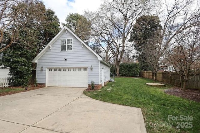 view of home's exterior with a garage, a yard, and fence