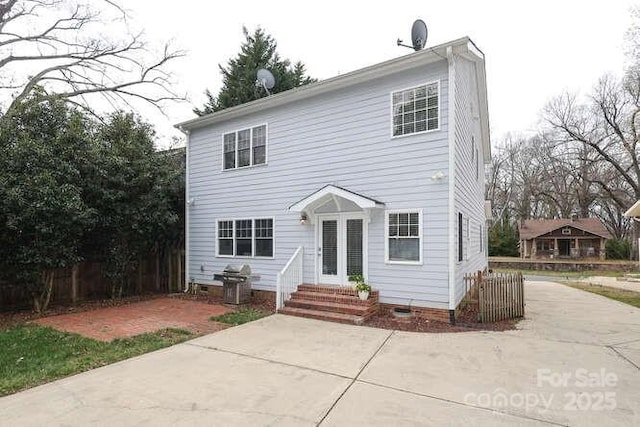 view of front of house featuring entry steps, a patio, and crawl space