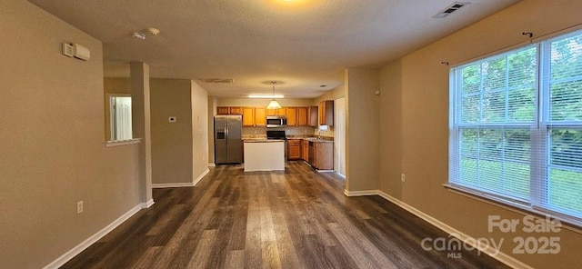 hall featuring dark wood-type flooring and baseboards