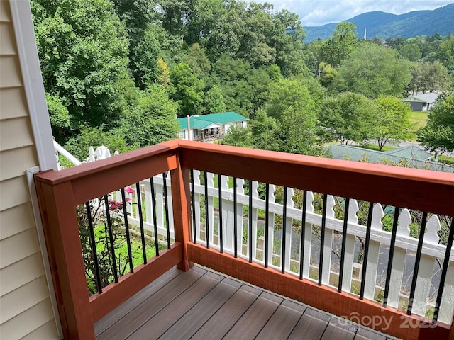 wooden terrace featuring a mountain view