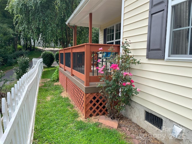 exterior space featuring crawl space and fence