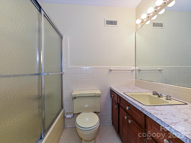 full bath with visible vents, vanity, toilet, and tile patterned floors