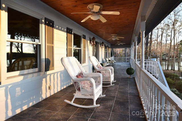 view of patio with ceiling fan and a porch