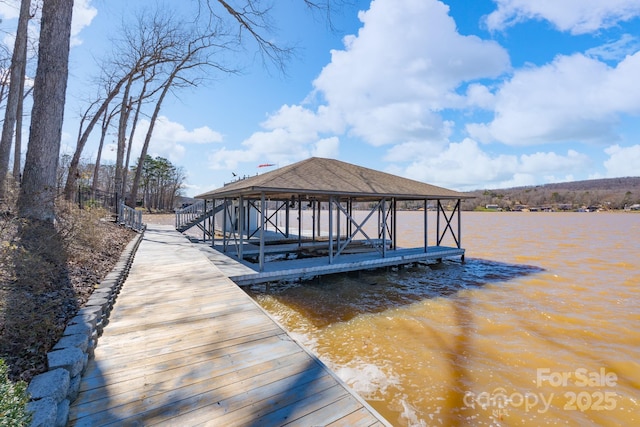 dock area featuring a water view and boat lift