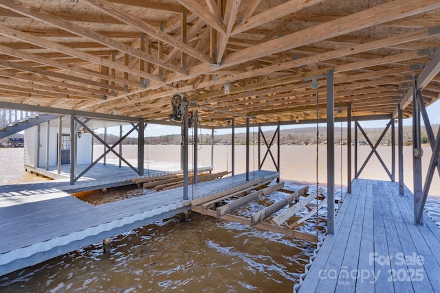 dock area featuring a water view and boat lift