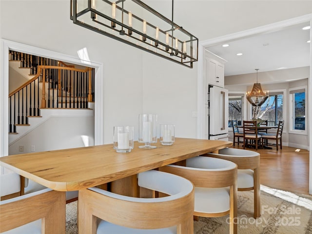 dining area featuring stairway, recessed lighting, wood finished floors, and baseboards