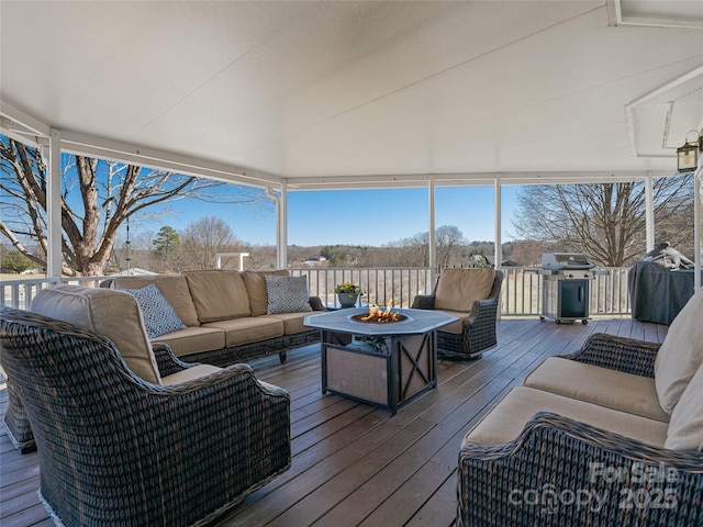 deck featuring an outdoor living space with a fire pit and grilling area