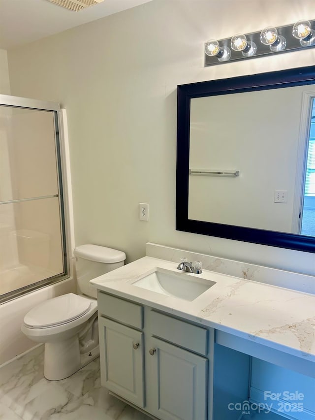 full bathroom with marble finish floor, shower / bath combination with glass door, visible vents, toilet, and vanity