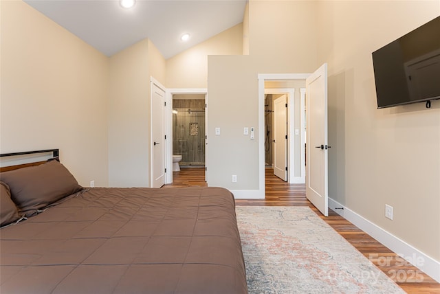 bedroom with recessed lighting, connected bathroom, baseboards, and wood finished floors