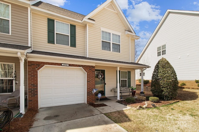 view of front of house featuring brick siding, driveway, an attached garage, and a shingled roof