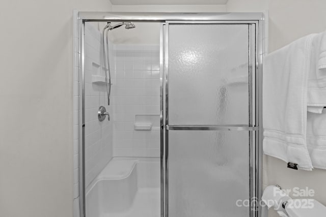 full bathroom with a shower stall