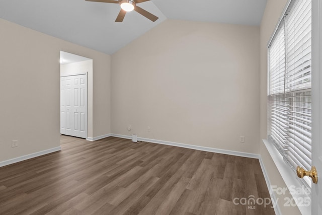 2592 Brackley Pl NW, Concord, NC 28027 - unfurnished bedroom with wood finished floors, lofted ceiling, baseboards, ceiling fan, and a closet