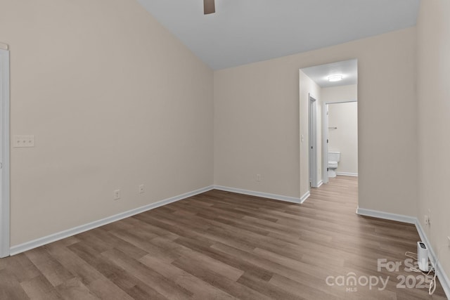 2592 Brackley Pl NW, Concord, NC 28027 - empty room featuring wood finished floors, ceiling fan, and baseboards