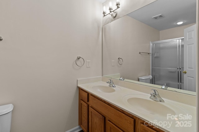 2592 Brackley Pl NW, Concord, NC 28027 - bathroom featuring toilet, double vanity, and a shower with door