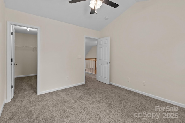 2592 Brackley Pl NW, Concord, NC 28027 - unfurnished bedroom featuring vaulted ceiling, carpet, a spacious closet, baseboards, and ceiling fan