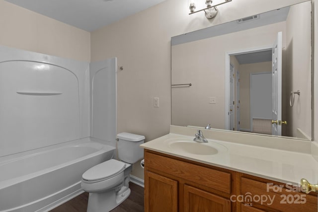 2592 Brackley Pl NW, Concord, NC 28027 - full bathroom featuring vanity, toilet, wood finished floors, shower / bathtub combination, and baseboards