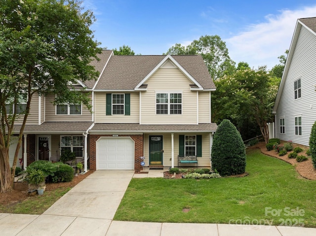 2592 Brackley Pl NW, Concord, NC 28027 - view of front of home with a porch, concrete driveway, a front lawn, and roof with shingles