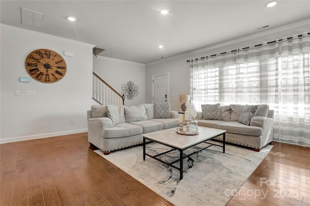 living room featuring recessed lighting, baseboards, stairs, hardwood / wood-style floors, and crown molding