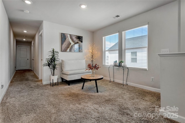 living area featuring carpet, visible vents, baseboards, and recessed lighting