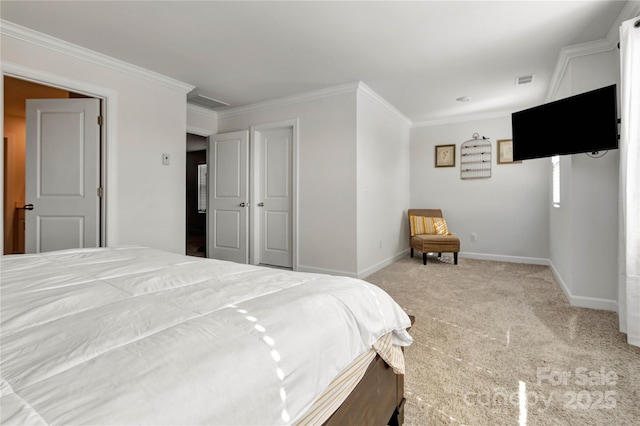 carpeted bedroom featuring baseboards, visible vents, and ornamental molding