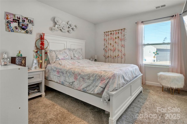 carpeted bedroom with baseboards and visible vents