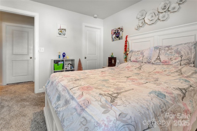 carpeted bedroom with baseboards