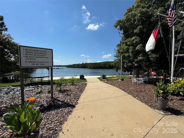 surrounding community with a water view