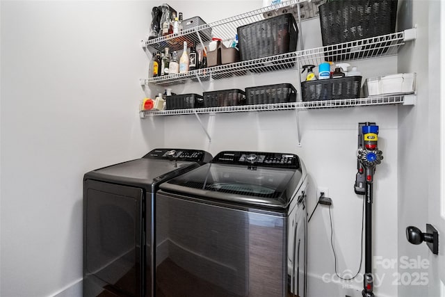 laundry area with laundry area and independent washer and dryer