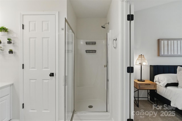 ensuite bathroom with a stall shower and connected bathroom