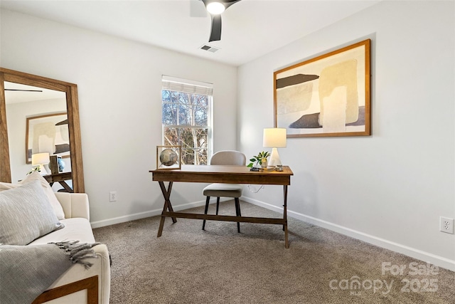 carpeted home office with baseboards, visible vents, and a ceiling fan