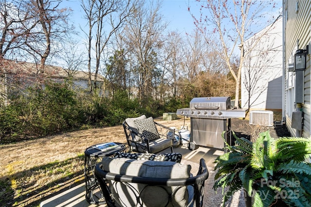 view of patio with central AC and grilling area