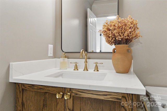 half bath featuring toilet and vanity