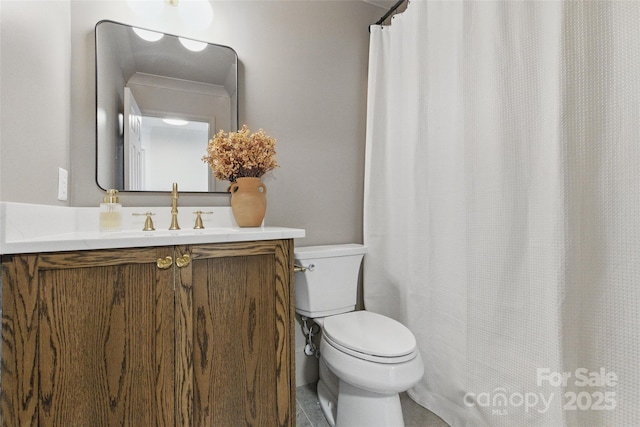 full bathroom featuring vanity and toilet