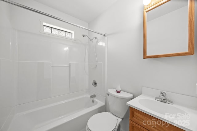 full bathroom featuring bathing tub / shower combination, vanity, and toilet