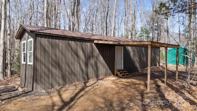 view of outdoor structure featuring entry steps and an outdoor structure