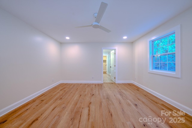 spare room with a ceiling fan, recessed lighting, baseboards, and light wood finished floors