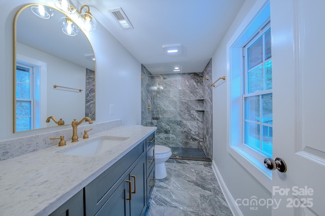 bathroom with visible vents, toilet, marble finish floor, vanity, and a shower stall