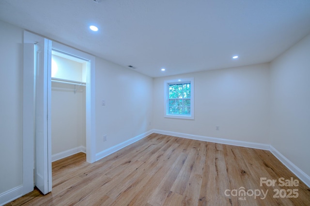 unfurnished bedroom featuring recessed lighting, baseboards, and wood finished floors