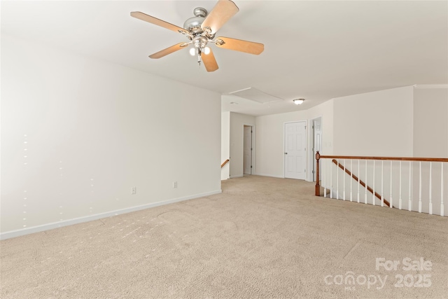 spare room with carpet and baseboards