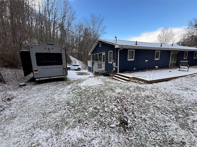 exterior space featuring a wooden deck