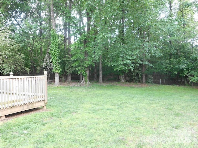 view of yard with a wooden deck