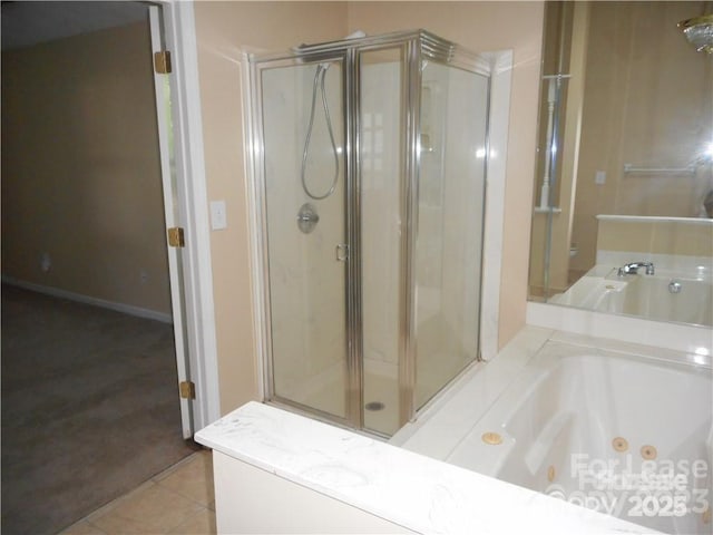 bathroom featuring a jetted tub, a shower stall, and tile patterned floors