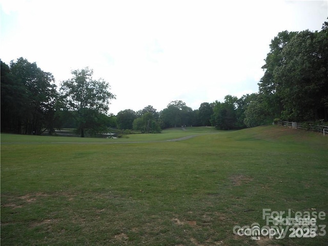 view of property's community with a yard