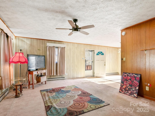 living room featuring a baseboard radiator, a textured ceiling, and carpet flooring